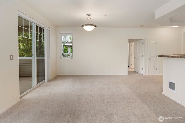 2220 132nd Ave SE Unit A220, Bellevue, WA 98005 - spare room with light colored carpet and baseboards