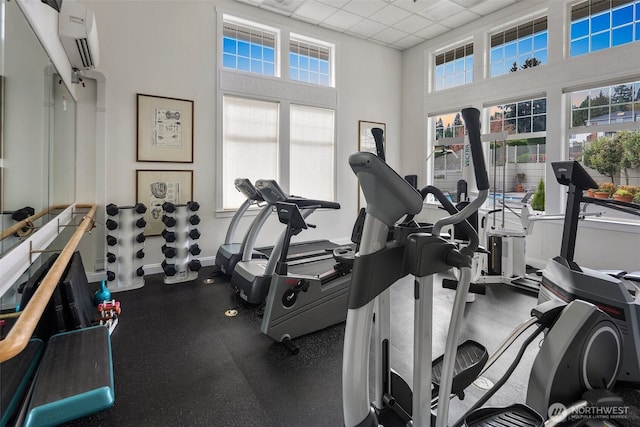 2220 132nd Ave SE Unit A220, Bellevue, WA 98005 - workout area featuring baseboards, a paneled ceiling, and a wall mounted AC