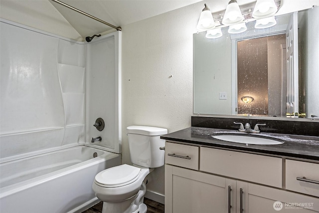 20007 17th Ave E, Spanaway, WA 98387 - full bath with vanity, shower / bathtub combination, toilet, and wood finished floors