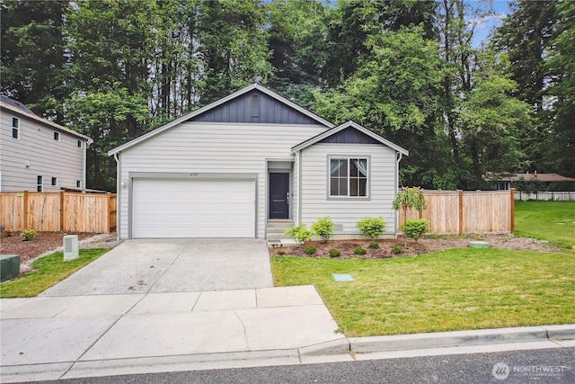4305 23rd Ct NE, Olympia, WA 98516 - ranch-style home featuring driveway, board and batten siding, and a garage