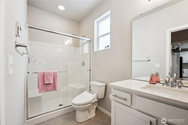 4305 23rd Ct NE, Olympia, WA 98516 - full bathroom featuring vanity, toilet, a stall shower, baseboards, and recessed lighting