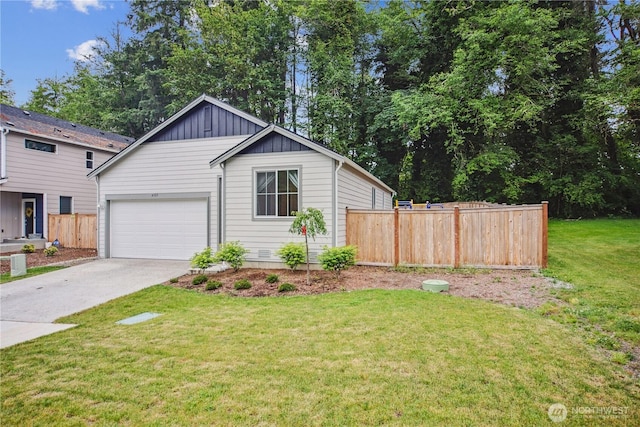 4305 23rd Ct NE, Olympia, WA 98516 - view of front facade featuring board and batten siding, concrete driveway, and an attached garage