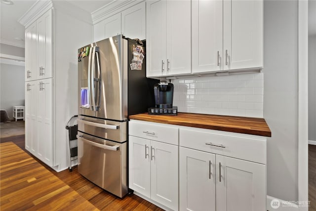 11012 36th St E, Edgewood, WA 98372 - kitchen with wood counters, stainless steel refrigerator with ice dispenser, ornamental molding, decorative backsplash, and dark wood finished floors