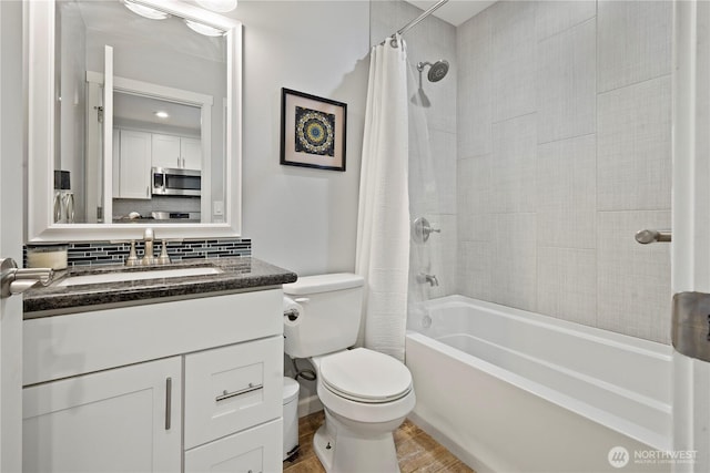 11012 36th St E, Edgewood, WA 98372 - full bathroom with vanity, shower / tub combo with curtain, decorative backsplash, and wood finished floors