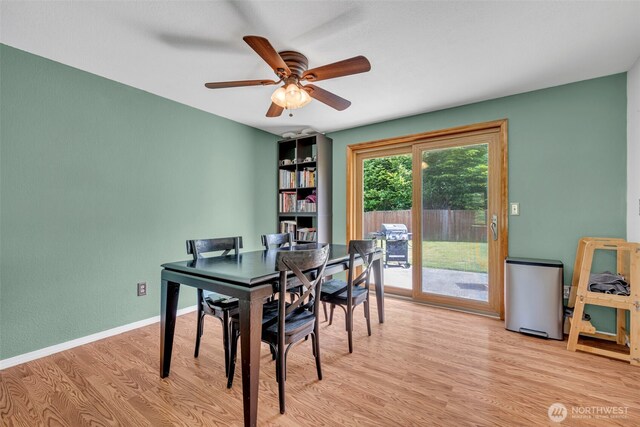 2779 Maple Tree Ln, Camano Island, WA 98282 - dining space featuring light wood-style floors, ceiling fan, and baseboards