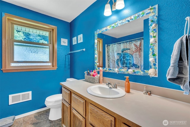 2779 Maple Tree Ln, Camano Island, WA 98282 - bathroom with toilet, vanity, and baseboards