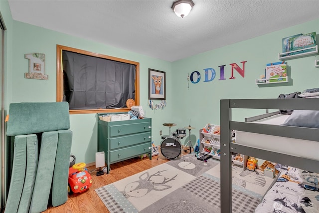 2779 Maple Tree Ln, Camano Island, WA 98282 - bedroom featuring wood finished floors and a textured ceiling