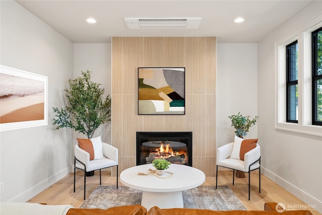 1831 4th St Unit B, Kirkland, WA 98033 - sitting room with wood finished floors, a large fireplace, baseboards, and recessed lighting