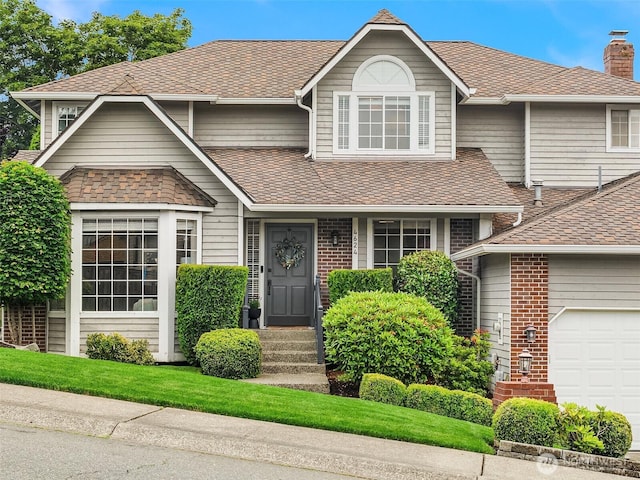 4624 SW 329th Way, Federal Way, WA 98023 - view of front facade with a chimney, a garage, roof with shingles, and brick siding