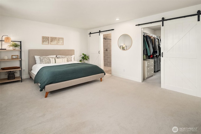 4624 SW 329th Way, Federal Way, WA 98023 - bedroom featuring a barn door, light carpet, a spacious closet, baseboards, and ensuite bathroom