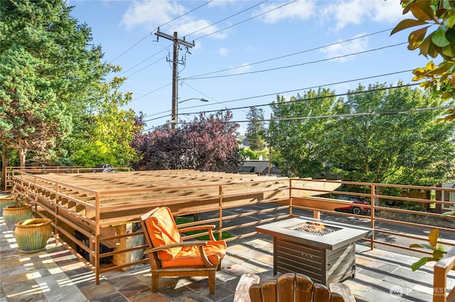 6970 California Ave SW Unit B304, Seattle, WA 98136 - wooden deck with an outdoor fire pit