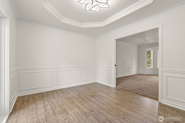 27701 NE 145th Pl, Duvall, WA 98019 - unfurnished room with wood finished floors, ornamental molding, a wainscoted wall, and a decorative wall