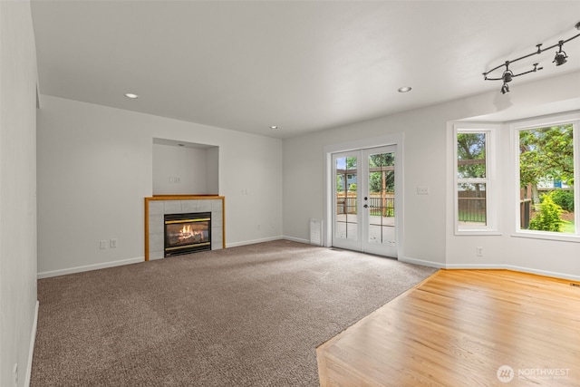 27701 NE 145th Pl, Duvall, WA 98019 - unfurnished living room with a tile fireplace, carpet, and recessed lighting