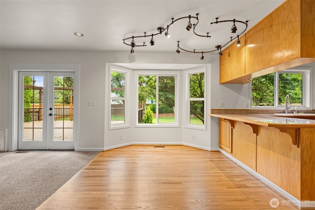 27701 NE 145th Pl, Duvall, WA 98019 - unfurnished dining area featuring french doors and light wood-style flooring