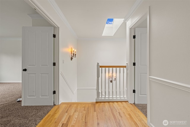 27701 NE 145th Pl, Duvall, WA 98019 - corridor with a skylight, crown molding, wood finished floors, and an upstairs landing