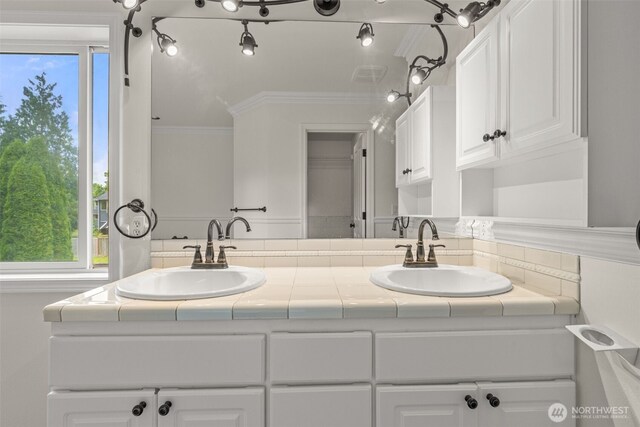 27701 NE 145th Pl, Duvall, WA 98019 - bathroom with double vanity, plenty of natural light, and ornamental molding