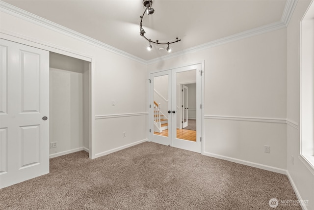 27701 NE 145th Pl, Duvall, WA 98019 - carpeted empty room featuring french doors, rail lighting, and crown molding
