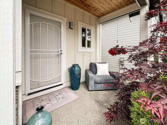 2744 S 120th Pl, Seattle, WA 98168 - view of exterior entry with board and batten siding and a porch