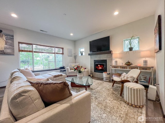 2744 S 120th Pl, Seattle, WA 98168 - living area with a tiled fireplace, recessed lighting, and wood finished floors