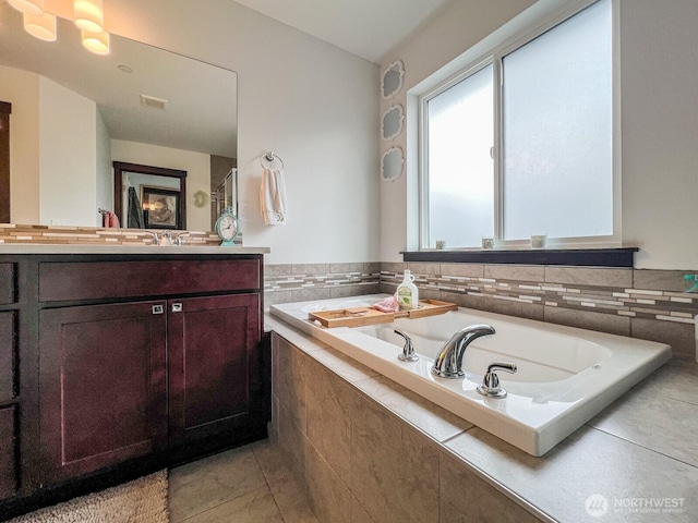 2744 S 120th Pl, Seattle, WA 98168 - full bathroom with vanity, a garden tub, and tile patterned flooring