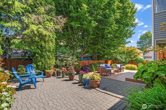 23976 SE 40th Pl, Sammamish, WA 98029 - fenced backyard with an outdoor living space, a wooden deck, and a patio area