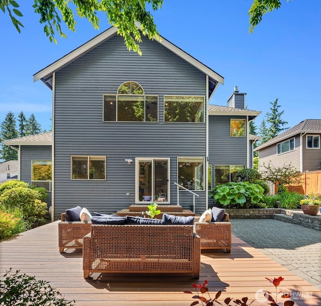 23976 SE 40th Pl, Sammamish, WA 98029 - rear view of house with outdoor lounge area, a wooden deck, and a chimney