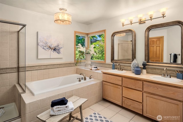 23976 SE 40th Pl, Sammamish, WA 98029 - bathroom with a garden tub, double vanity, tile patterned flooring, and a stall shower