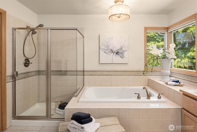 23976 SE 40th Pl, Sammamish, WA 98029 - full bathroom featuring a bath, a shower stall, vanity, and tile patterned flooring