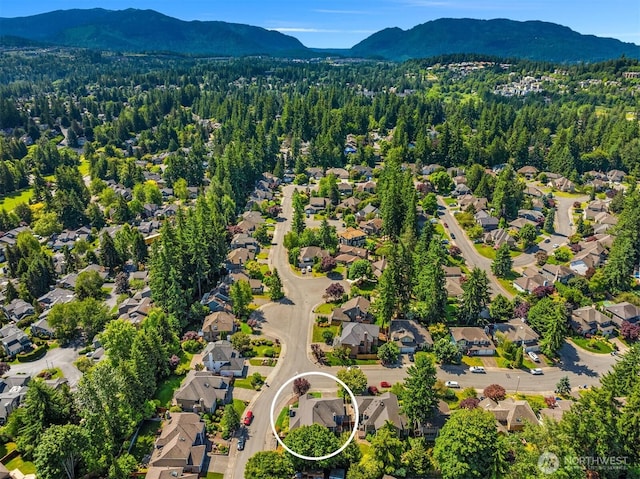 23976 SE 40th Pl, Sammamish, WA 98029 - aerial view of residential area featuring mountains and a heavily wooded area
