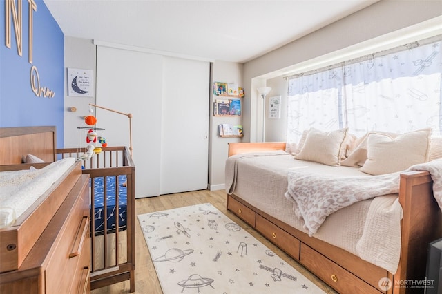 130 SW 116th St Unit F32, Seattle, WA 98146 - bedroom with light wood-type flooring and a closet