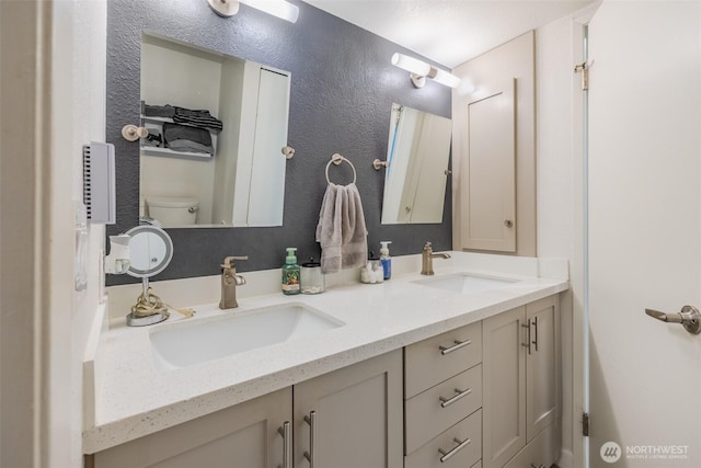 130 SW 116th St Unit F32, Seattle, WA 98146 - bathroom featuring toilet and double vanity