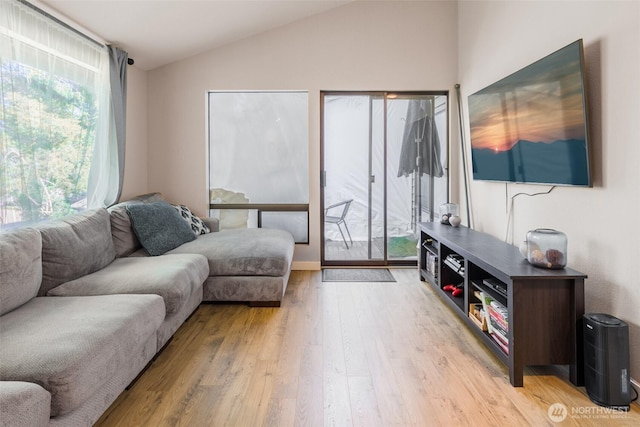 130 SW 116th St Unit F32, Seattle, WA 98146 - living area featuring lofted ceiling and light wood-type flooring