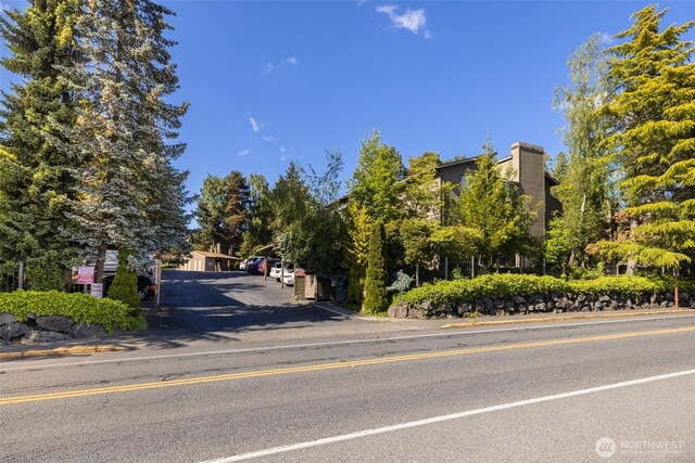 130 SW 116th St Unit F32, Seattle, WA 98146 - view of asphalt road featuring curbs