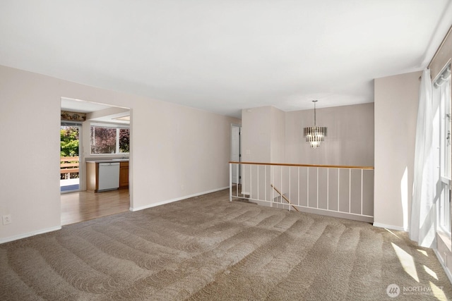 4206 SE 1st Pl, Renton, WA 98059 - empty room featuring carpet floors, a chandelier, and baseboards