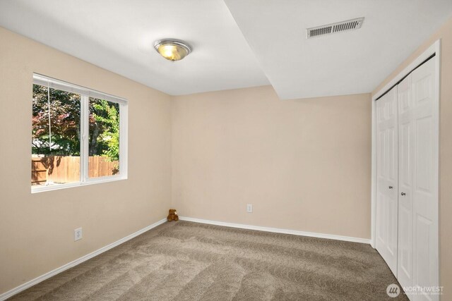 4206 SE 1st Pl, Renton, WA 98059 - unfurnished bedroom with carpet, baseboards, and a closet
