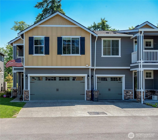 8713 E Gilman Ave, Arlington, WA 98223 - view of front of property with stone siding, a garage, and driveway