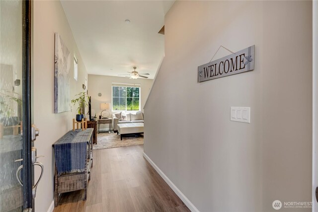 8713 E Gilman Ave, Arlington, WA 98223 - corridor featuring wood finished floors and baseboards