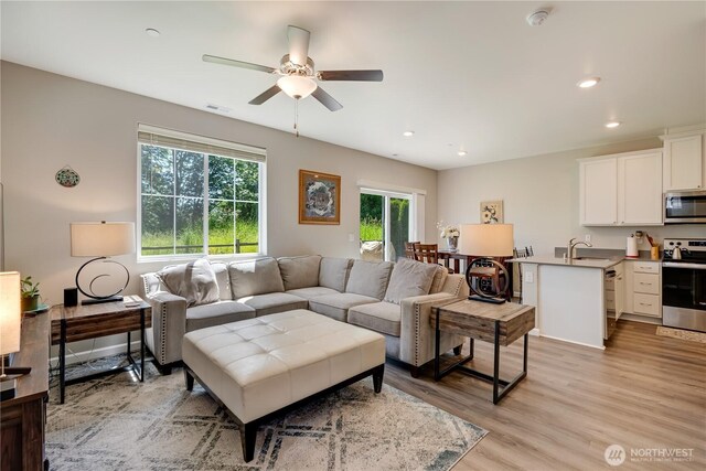 8713 E Gilman Ave, Arlington, WA 98223 - living area with a ceiling fan, recessed lighting, and light wood-style floors