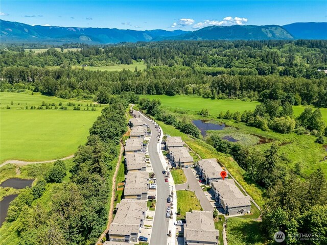 8713 E Gilman Ave, Arlington, WA 98223 - drone / aerial view of a water and mountain view and a heavily wooded area