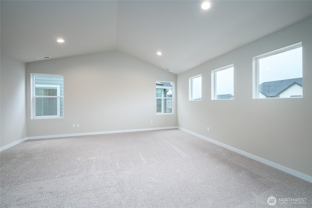 14516 204th Ave E Unit 895, Bonney Lake, WA 98391 - spare room with vaulted ceiling, recessed lighting, baseboards, and light colored carpet