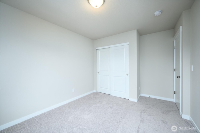 14516 204th Ave E Unit 895, Bonney Lake, WA 98391 - unfurnished bedroom with carpet floors, a closet, and baseboards