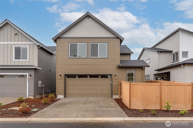 14516 204th Ave E Unit 895, Bonney Lake, WA 98391 - view of front of home featuring an attached garage, driveway, a shingled roof, and board and batten siding