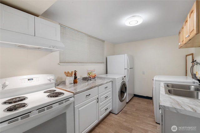 29356 38th Pl S, Auburn, WA 98001 - kitchen featuring white appliances, washer / dryer, light wood finished floors, and light countertops
