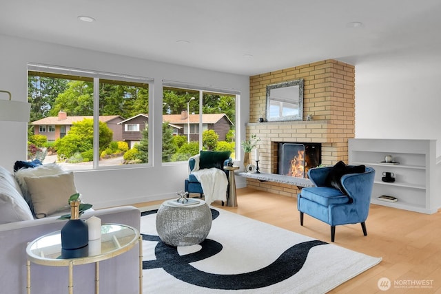 15226 116th Pl NE, Kirkland, WA 98034 - living room with a brick fireplace and wood finished floors
