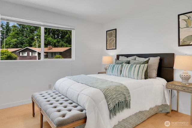 15226 116th Pl NE, Kirkland, WA 98034 - bedroom with multiple windows and wood finished floors