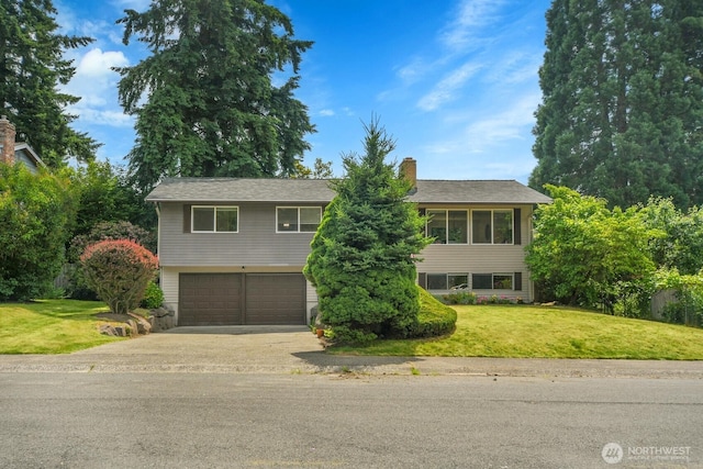 15226 116th Pl NE, Kirkland, WA 98034 - view of front facade featuring concrete driveway, an attached garage, a front yard, and a chimney