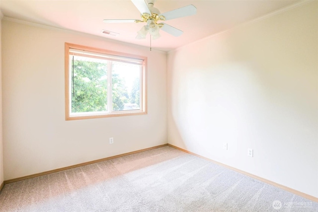 1404 102nd St E, Tacoma, WA 98445 - unfurnished room featuring light colored carpet, a ceiling fan, and crown molding