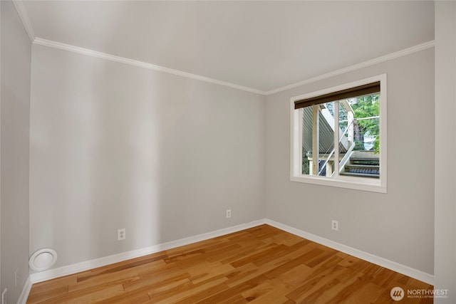 2400 E Howell St Unit G, Seattle, WA 98122 - unfurnished room featuring ornamental molding, baseboards, and wood finished floors