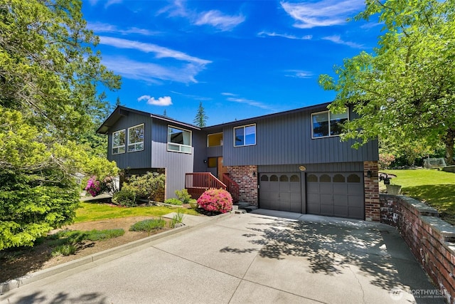 801 38th St, Bellingham, WA 98229 - raised ranch featuring brick siding, a garage, and concrete driveway