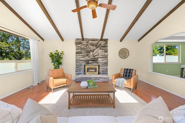 801 38th St, Bellingham, WA 98229 - living room with wood finished floors, a stone fireplace, ceiling fan, and baseboards
